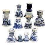 A collection of Chinese blue and white campana shaped incense holders. (10)