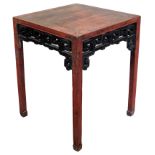 A Chinese red and black lacquer table, 84cm high, 66cm square.