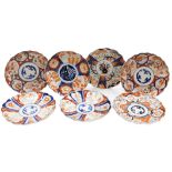 Seven Meiji period Japanese porcelain Imari plates, each of scalloped form, each variously decorated