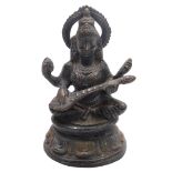 A bronze figure of Sarasvati, Hindu goddess of wisdom music and learning, seated in padmasana pose o