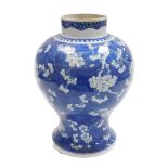 A 19thC Qing Dynasty blue and white porcelain vase, of baluster form, decorated with prunus blossom