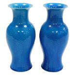 A pair of Chinese turquoise porcelain baluster vases, incised with stylised chrysanthemum heads, wit