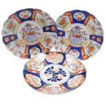 Two Meiji period Japanese Imari porcelain dishes, each of scalloped form, decorated centrally with a