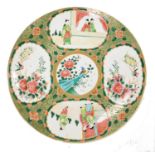 A mid century Chinese famille rose porcelain charger, decorated with reserves of figures, birds and