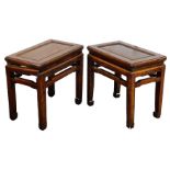 A pair of Chinese hardwood tables, with bat carved friezes, 49cm high, 53cm wide, 34cm deep.