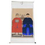 A Chinese ceremonial ancestor portrait scroll, depicting two family members in front of a table bea