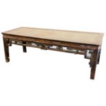 A Chinese hardwood table, with raffia top, 57cm high, 170cm wide, 60cm deep.