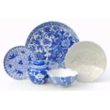 A group of blue and white Oriental ceramics, to include a transfer printed dish decorated with two b