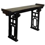 A Chinese altar table, with over hanging top, scrolling frieze and open work sides, 93cm high, 160cm