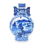 A Chinese blue and white porcelain moon flask, decorated to both sides with panels of buildings in l