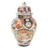 A 20thC Japanese Imari porcelain vase and cover, in 18thC style, of octagonal form, decorated with p