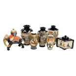 A collection of Japanese Satsuma ware, including five ovoid vases, a lozenge shaped pot pourri jar a
