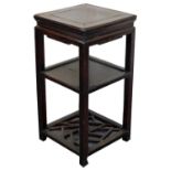 A Chinese hardwood tea table, 79cm high, 40cm square.