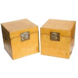 A pair of Chinese yellow lacquer chests, of square section, with twin carrying handles, each 40cm hi