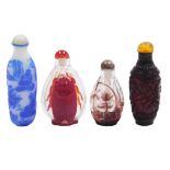 Four Chinese cameo glass snuff bottles, decorated with a cicada in red, 7cm high, seated figures in