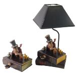 A Charles Dickens inspired grotesque pottery book shaped box, 20cm wide, and a similar table lamp. (