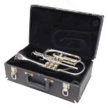 A Conn 31A 1000 cornet, with three mother of pearl finished valves, 36cm long, cased.