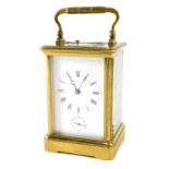 An early 20thC brass minute repeating carriage clock, with Roman numeric dial subsidiary Arabic seco