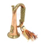 A 20thC copper and brass bugle, with Royal Welsh Fusilier's emblem, 27cm high.