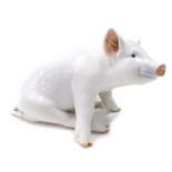 A Royal Copenhagen figure of a pig, number 414, printed marks beneath, 16cm high.