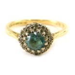 An 18ct gold diamond and aquamarine set dress ring, size K, 3g all in.