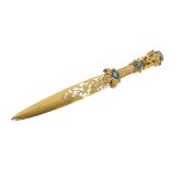 A 19thC gilt metal paper knife, the handle with cherub pommel set with a compressed green stone, wit
