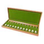 A Queen Elizabeth II John Pinches Royal Horticultural Society silver spoon set, to include rose, 12c