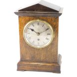 An early 20thC RAF oak cased mess clock, the 14cm diameter Roman numeric dial in an architectural ca