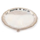 An Elizabeth II silver pie crust salver, by H. L. Brown and Sons, with plain centre, on ball and cla