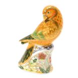 A Royal Crown Derby paperweight ornament Sun Parakeet, gilt stopper, printed marks beneath, 16cm hig