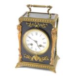 A late 19thC gilt metal and ebonised mantel clock, with enamel 9cm diameter Roman numeric dial in an