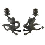 A pair of bronze dragon candlesticks, unsigned, 20cm high.