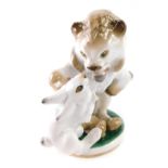 A Lomonosov Russian figure of a rabbit and lion, marked beneath, 15cm high.