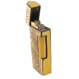 A 20thC Dunhill pocket lighter, with textured finish and yellow enamel sides, marked beneath, 7cm hi
