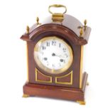 A late 19thC mahogany bracket clock, the 11cm diameter enamel dial surmounted with pineapple finials