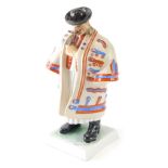A Herend Hungary porcelain figure of a gentleman, in flowing robes, on square base, polychrome decor