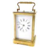 An early 20thC brass minute repeating carriage clock, with 6cm wide back plate, Roman numeric dial,