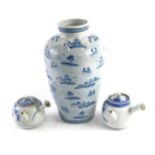 An Oriental porcelain blue and white vase, decorated with landscapes, etc., and two Japanese sake po