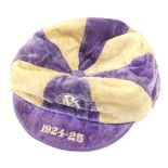 An early 20thC football cap, in purple and white, initialled and dated 1924-25.