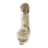 A hollow USSR pottery figure of a girl in flowing robes, labelled, 31cm high.