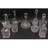Various cut glass crystal and other decanters, a spirit jug with plated mounts, and spirit label, a