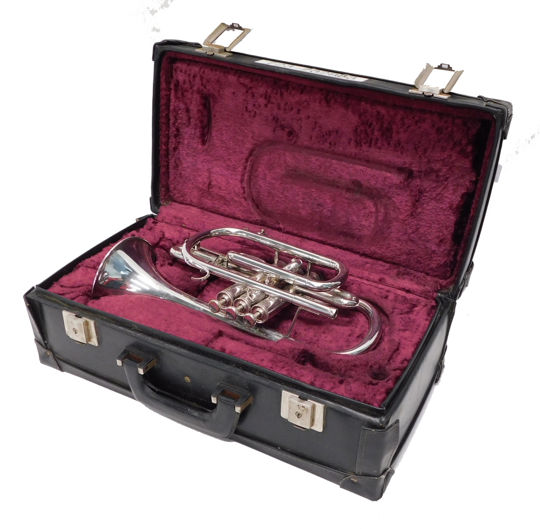 A Boosey & Hawkes Besson 700 cornet, with three valves, 35cm long, cased.