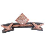 A 20thC Art Deco marble clock garniture, the diamond shaped mantel clock on curved base and square p