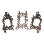 Two bronze coloured metal rococo style frames, profusely decorated with scrolls and figures, with ea
