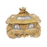 A 19thC French Sevres style porcelain and ormolu casket, with cherub and entwined garland knop, and