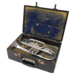 An FB Besson New Standard cornet, with three valves, 31cm long, cased.