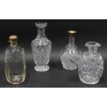 Various decanters, one with silver collar, star cut with flowers and hob nail cut decoration, 22cm h