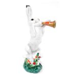 A Lomonosov Factory Russian porcelain figure of a hare playing trumpet, marked BC beneath, 19cm high