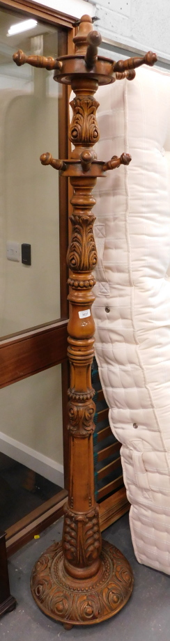 A heavily carved oak hat and coat stand.