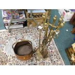 A brass fireside companion set and a copper and brass coal helmet